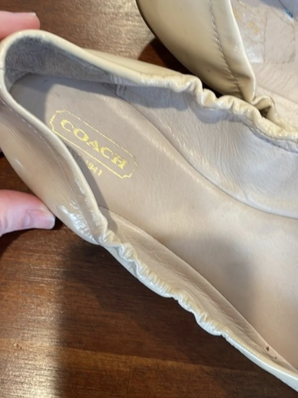 Coach Two-Tone Patent Bow Cap-Toe Ballet Flats in Beige and Black